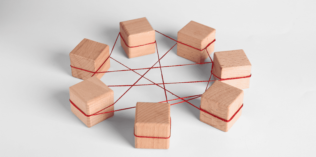 Wooden cubes tied with red thread